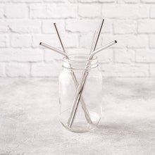 Load image into Gallery viewer, silver reusable straws in glass