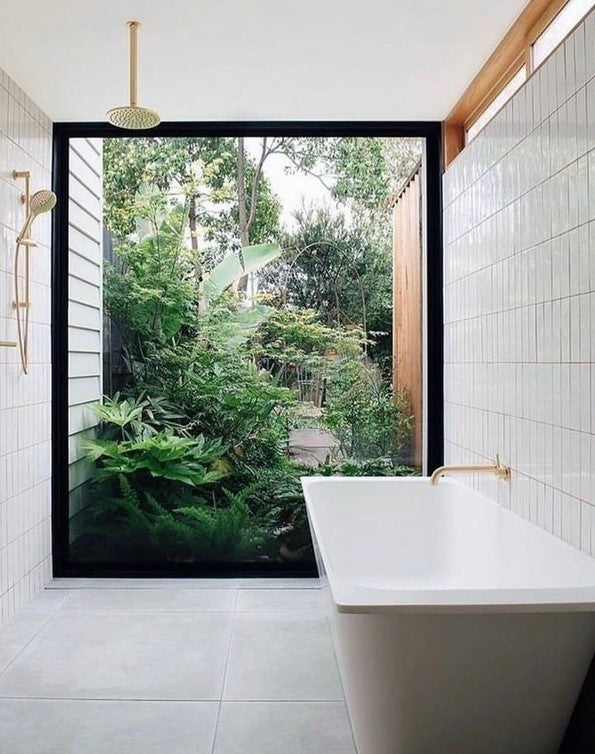 white bathroom with greenery