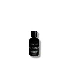 Travel-size LOTION AF by FORK & MELON — fragrance-free, clean luxury lotion in sleek black 2oz bottle.
