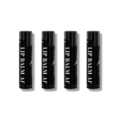 FORK & MELON LIP BALM AF clean luxury lip balm set — fragrance-free, unflavored moisturizing lip care in sleek black tubes, shown in a set of four.