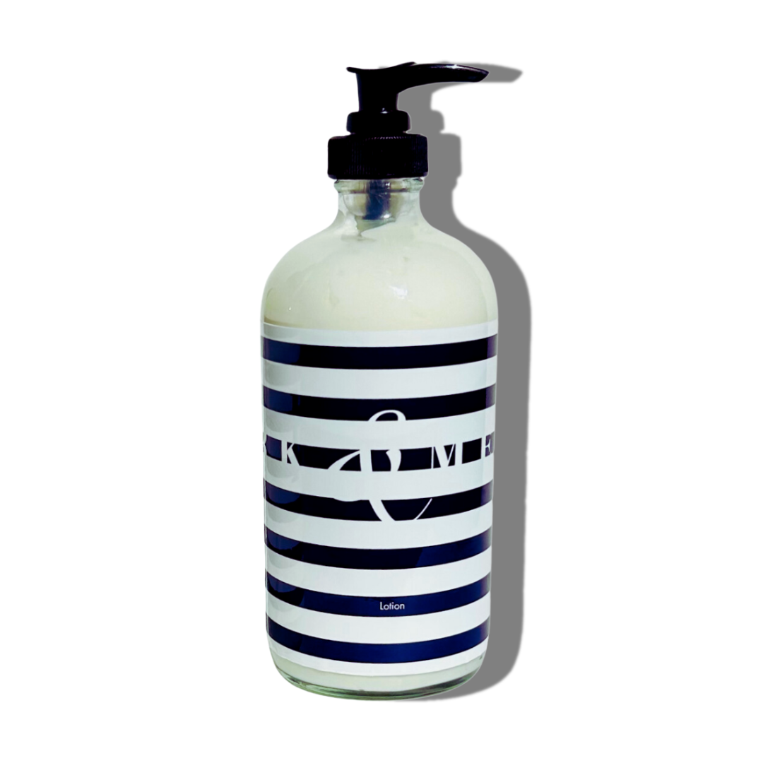 FORK & MELON clean luxury lotion with dark navy and white stripe bottle design