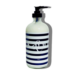 FORK & MELON clean luxury lotion with dark navy and white stripe bottle design