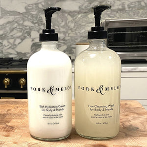 glass soap & lotion set in marble kitchen